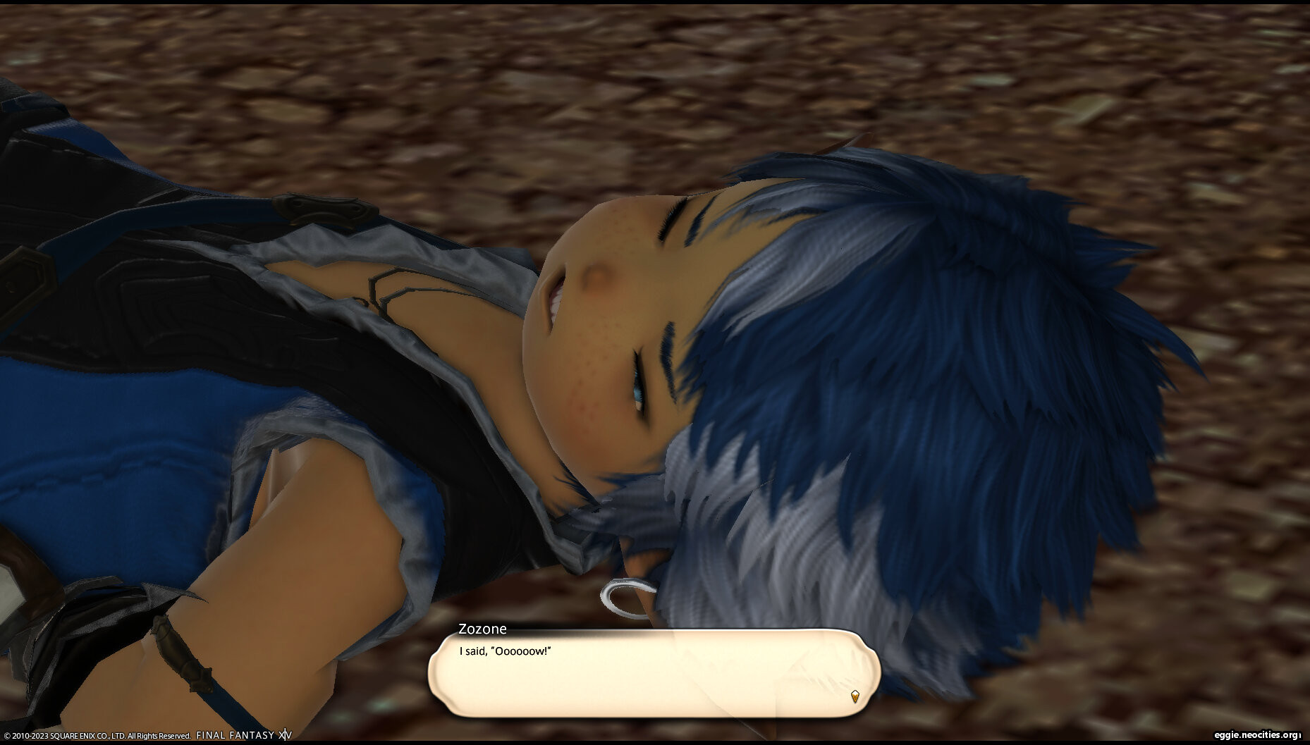 A blue and white haired lalafell is lying on the ground, his face in a grimace. He has a dialogue box that shows his name as Zozone. He says: I said Oooooow.