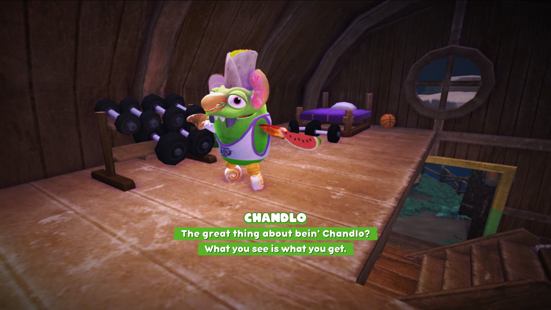 A screenshot of Chandlo in his room in the Old Mill House, standing beside his dumbell rack with his arms spread wide. His dialogue says: The great thing about being Chandlo? What you see is what you get.