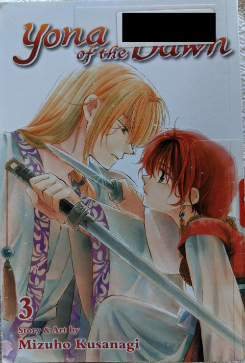 Cover for Yona of the Dawn Volume 3. Yona and Suwon are facing each other. Yona has a knife to Suwon's throat, and Suwon is holding a short sword