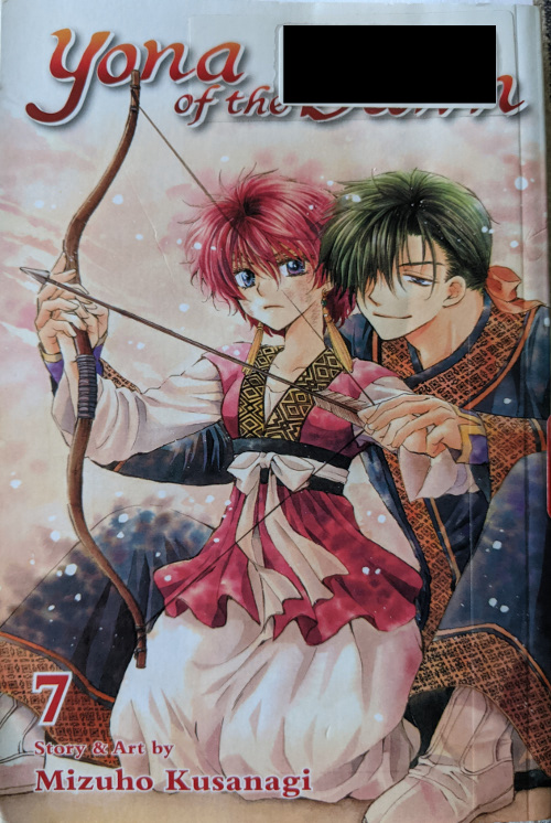 Cover for Yona of the Dawn Volume 7. Yona is kneeling on the ground with Jaeha sitting behind her. He is showing her how to draw a bow and arrow.